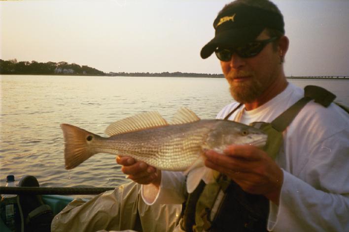 Kayak fishing in Virginia, Kayak kevin cathces a 19 inch red drum in June 2007